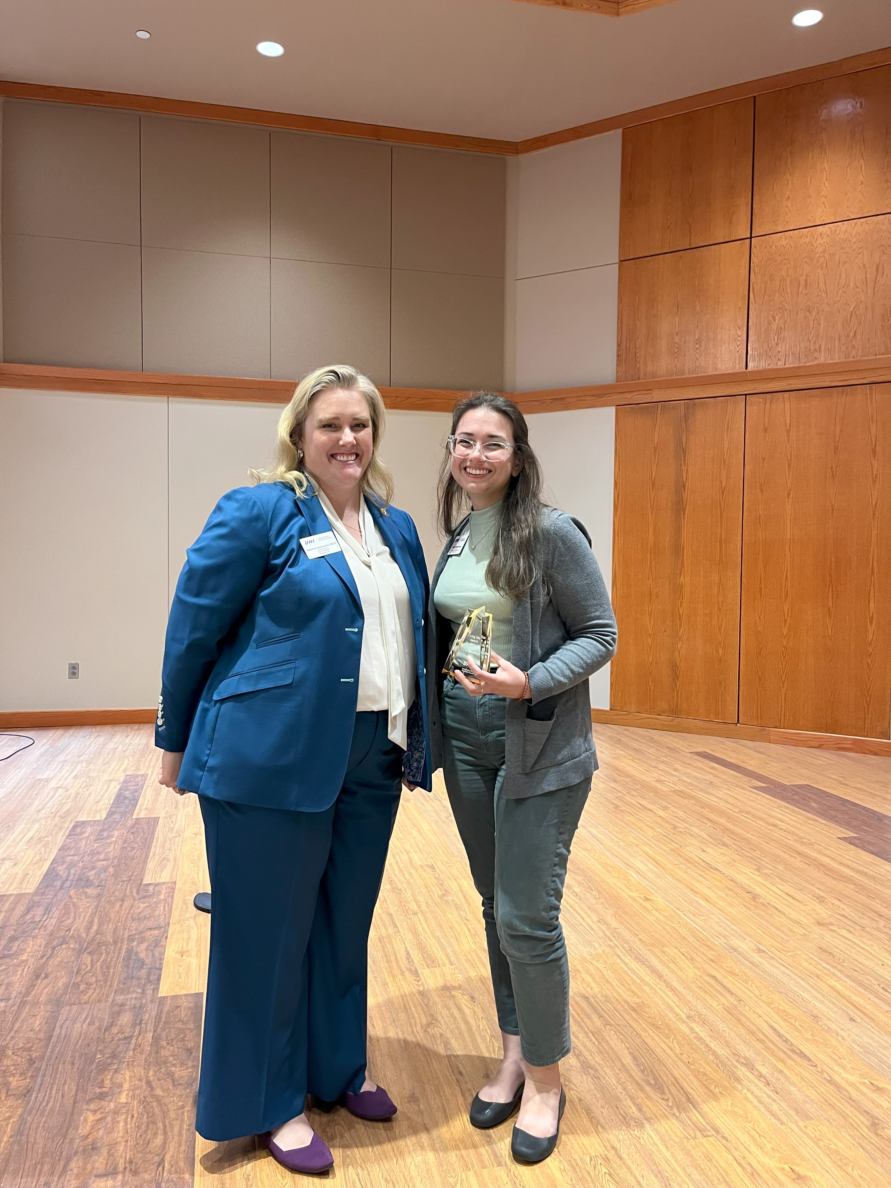 Jayda Baumhover receives the Rising Star Award from Heather Schroeder.